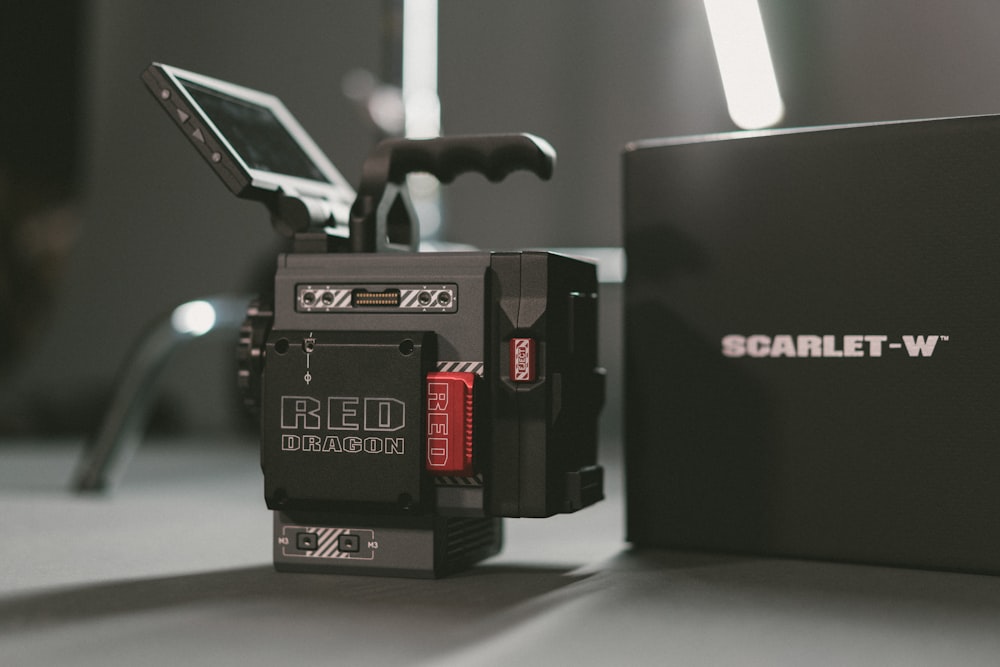 close-up photography of Red Scarlet-W camera with box