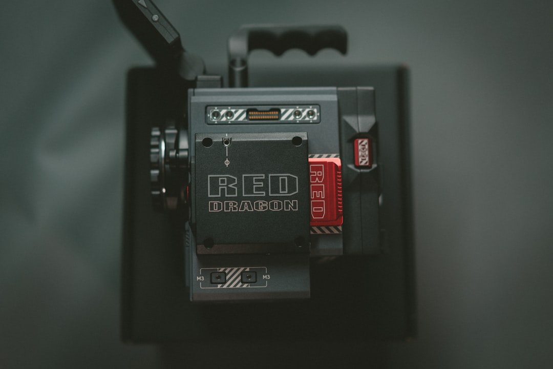 a red dragon camera attached to a cell phone