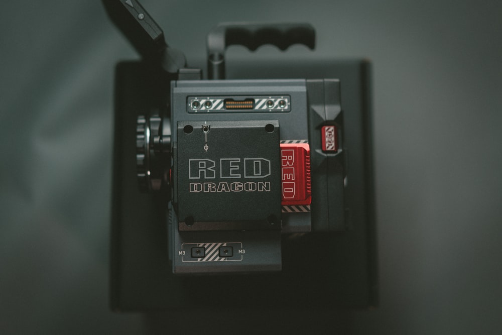 a red dragon camera attached to a cell phone