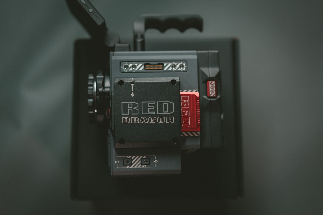 a red dragon camera attached to a cell phone,