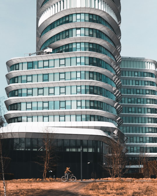 man riding bike near building in Groningen Netherlands