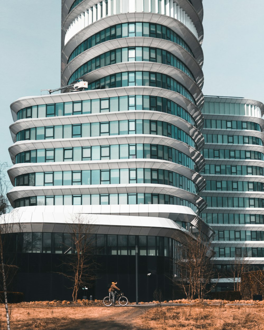 man riding bike near building