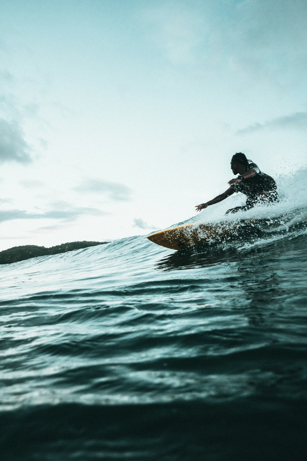 man surfboarding during daytime