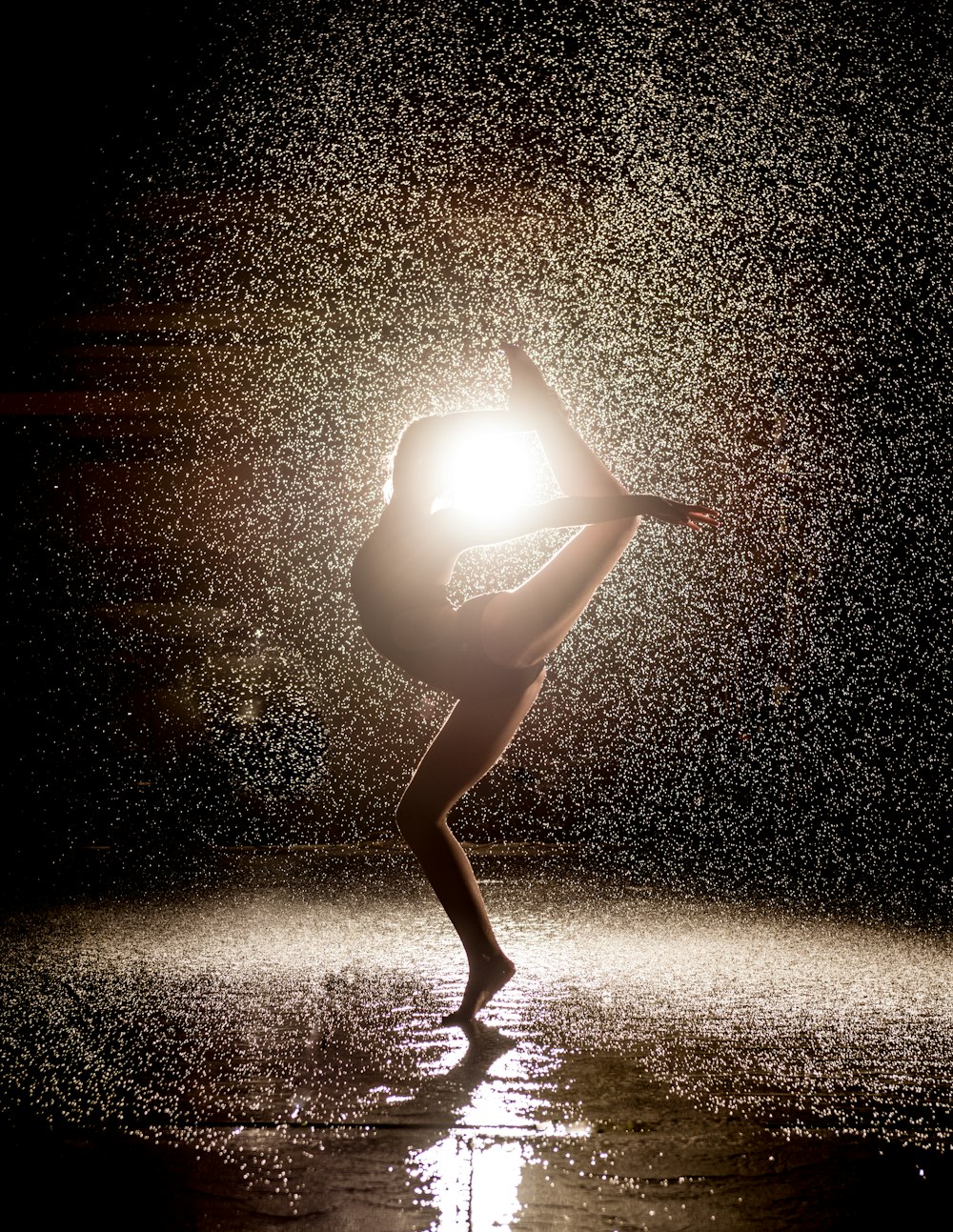 woman dancing in the rain