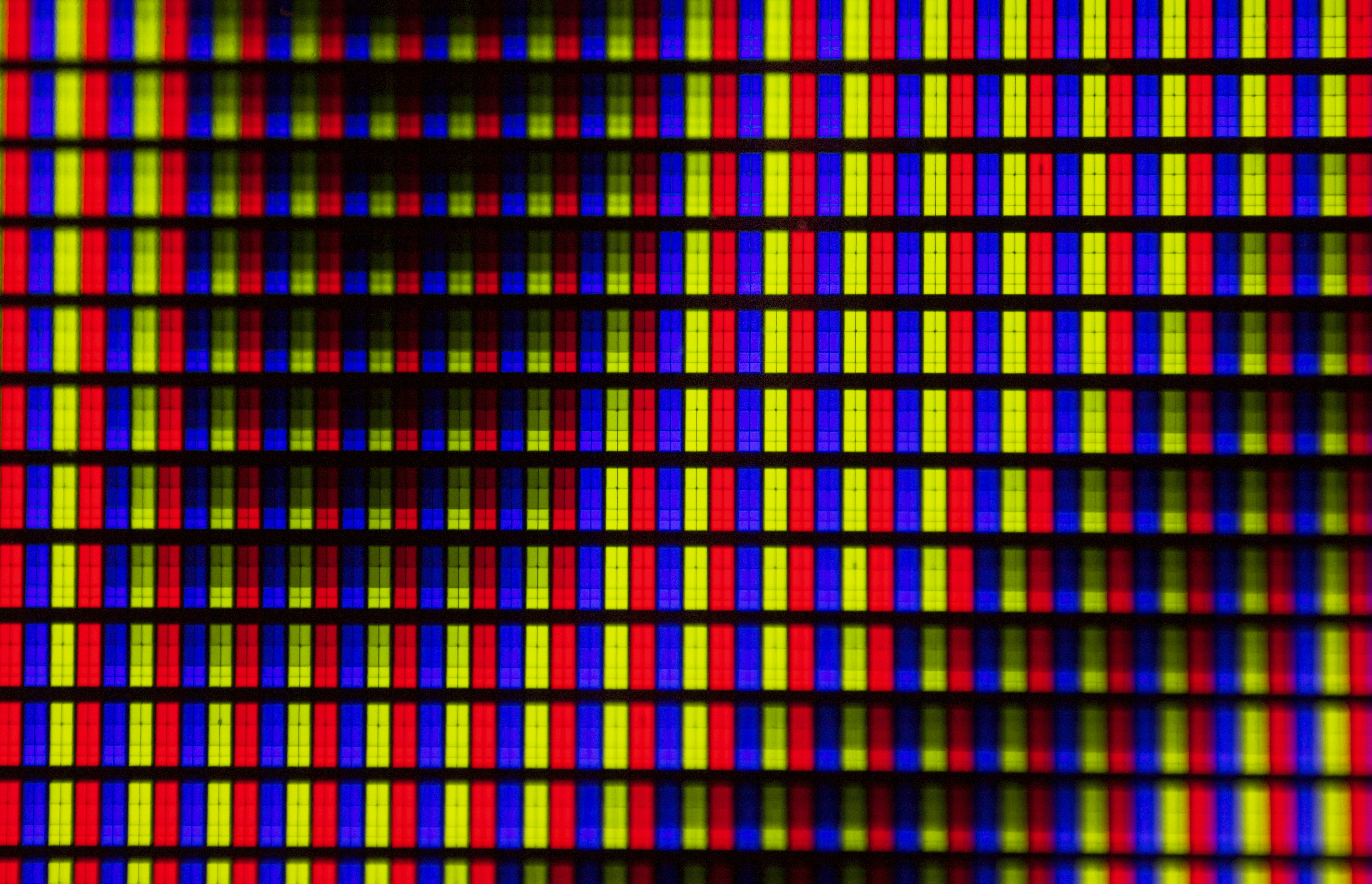 close up macro of oled panel pixels displaying vivid colors
