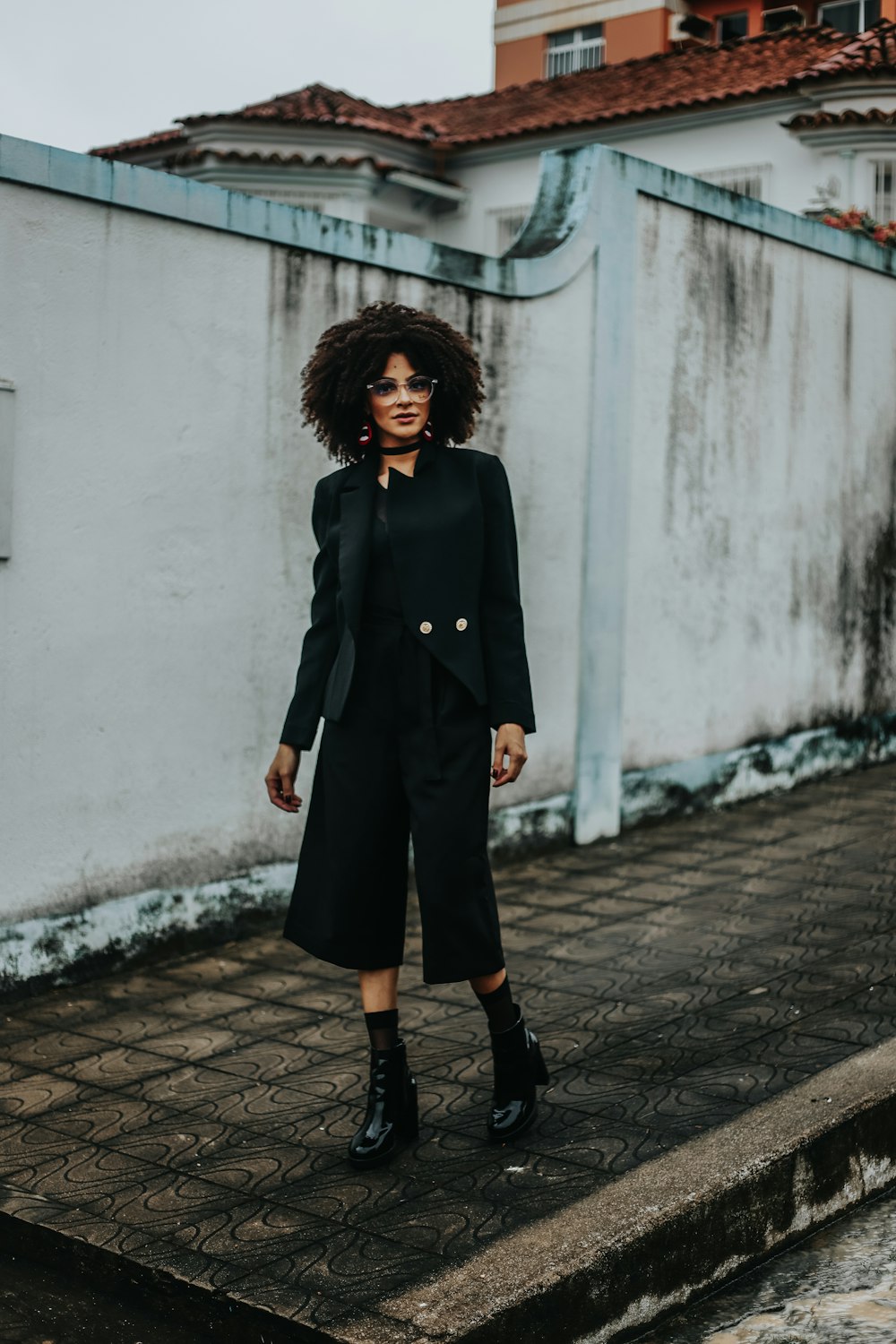 woman walking on sidewalk