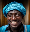man wearing blue headdress