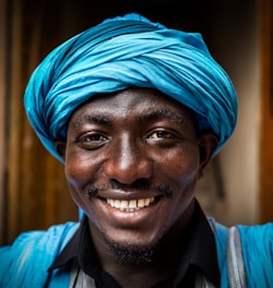 man wearing blue headdress