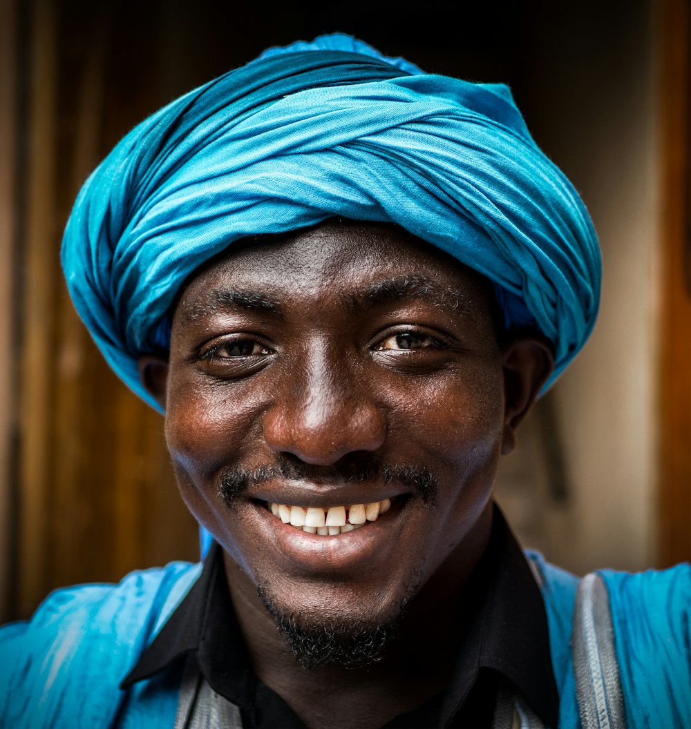 man wearing blue headdress