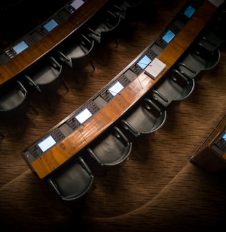 low light photography of armchairs in front of desk