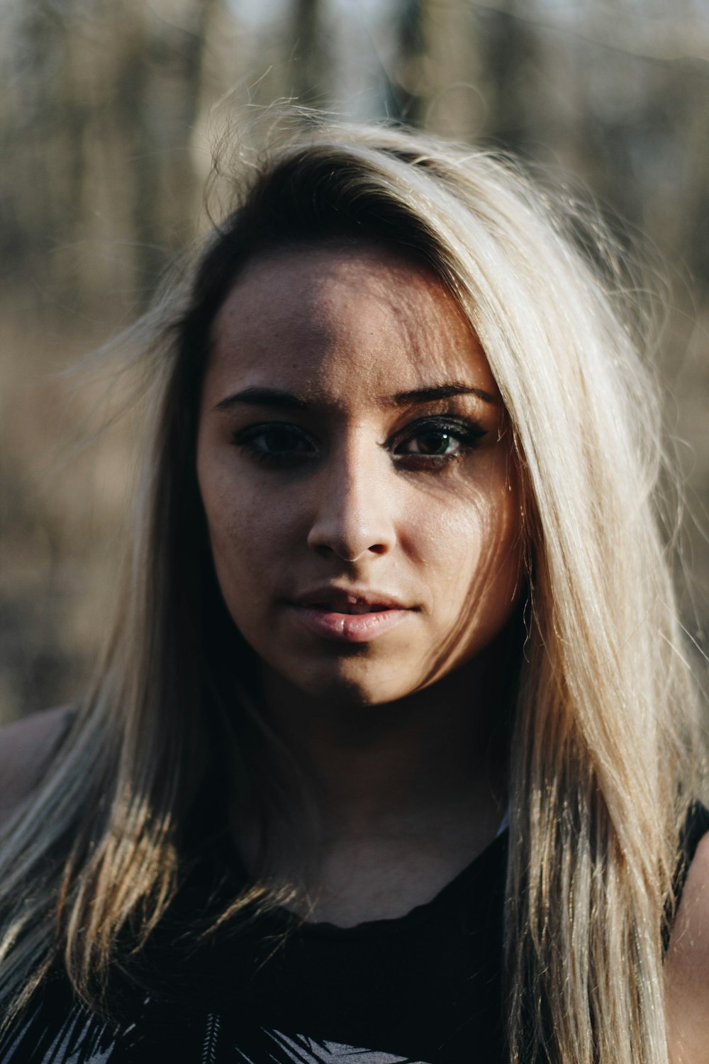 selective focus photography of woman's face wearing eyeliner at daytime