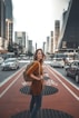woman standing on middle of road