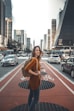 woman standing on middle of road