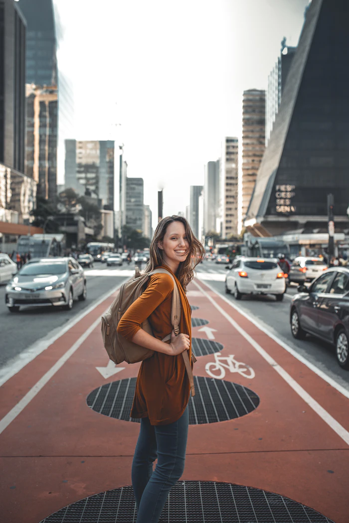 A traveller standing on an open road