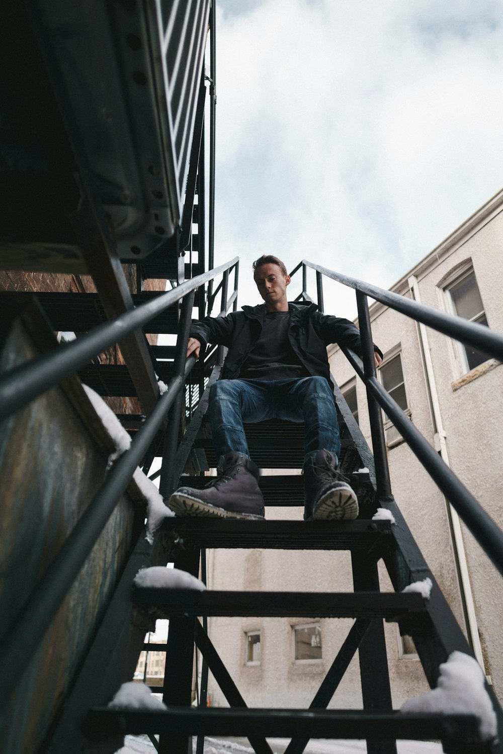 man sitting on stairs