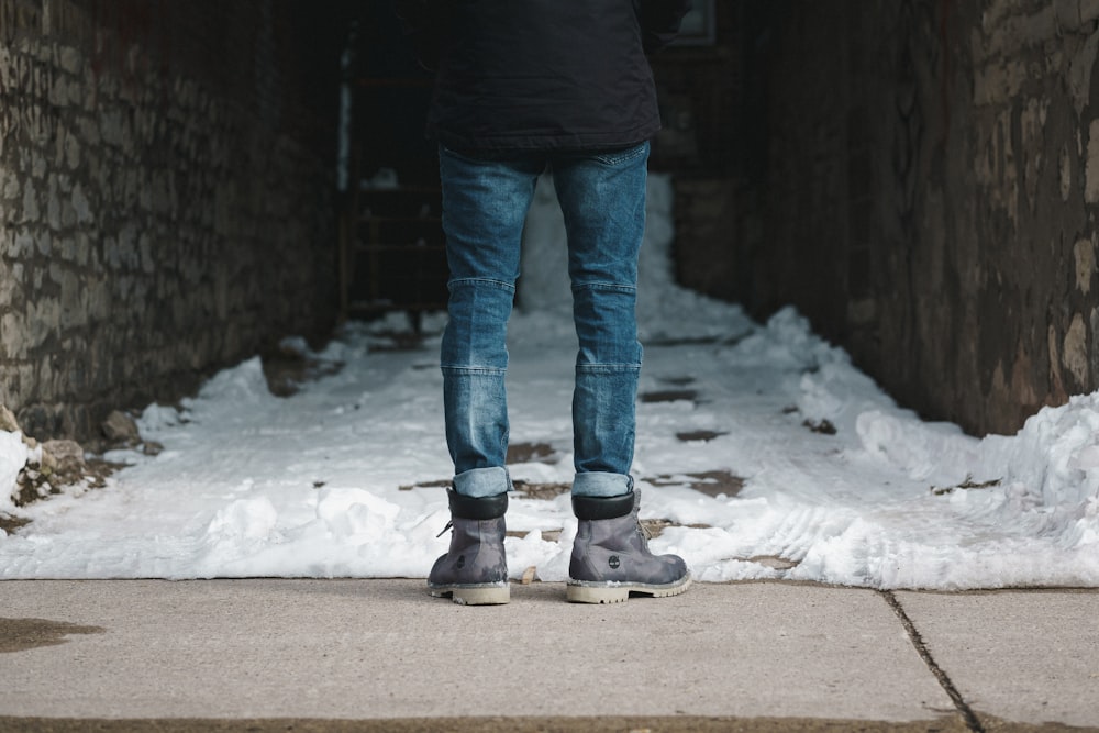 person wearing blue jeans