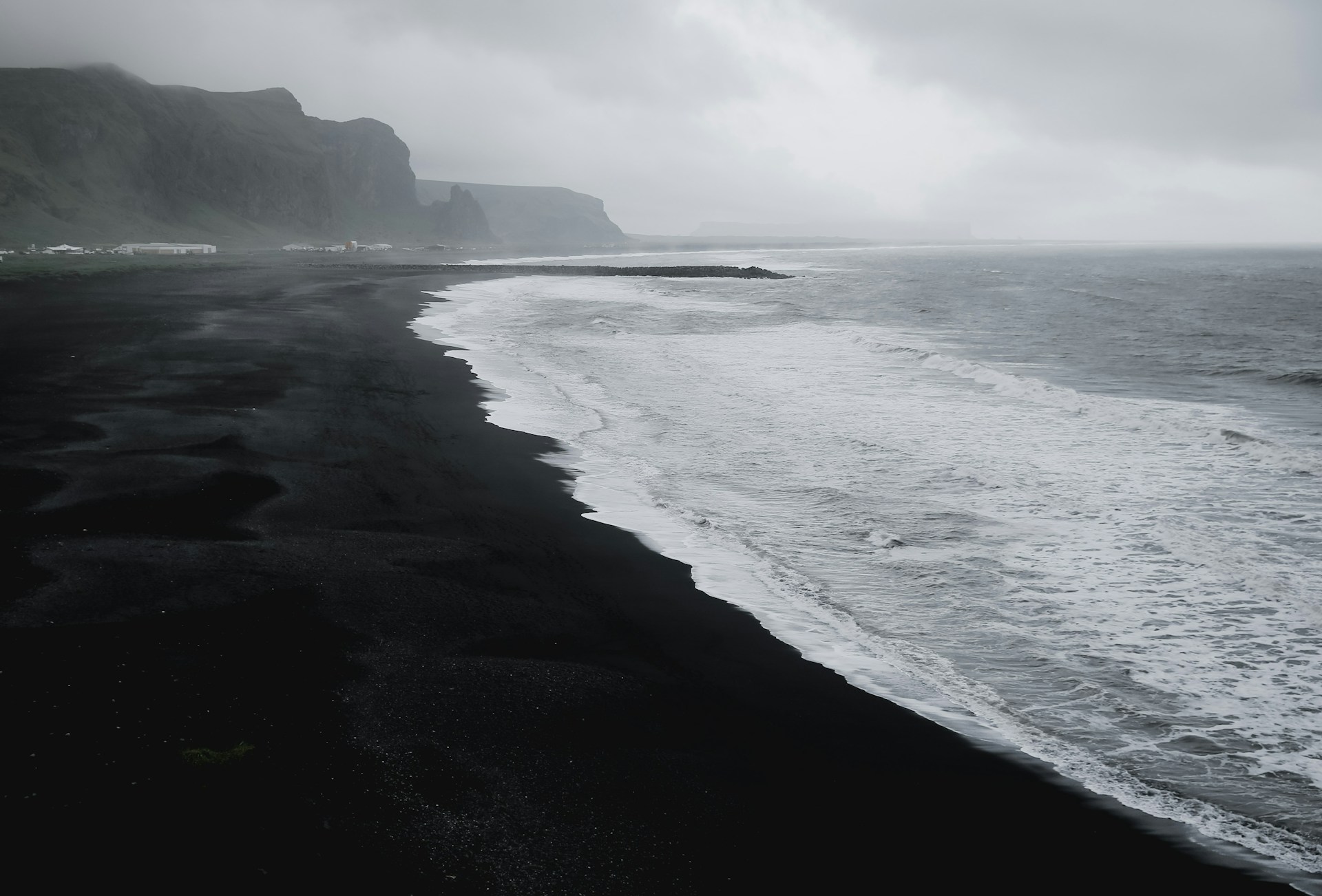 seashore in grayscale photo