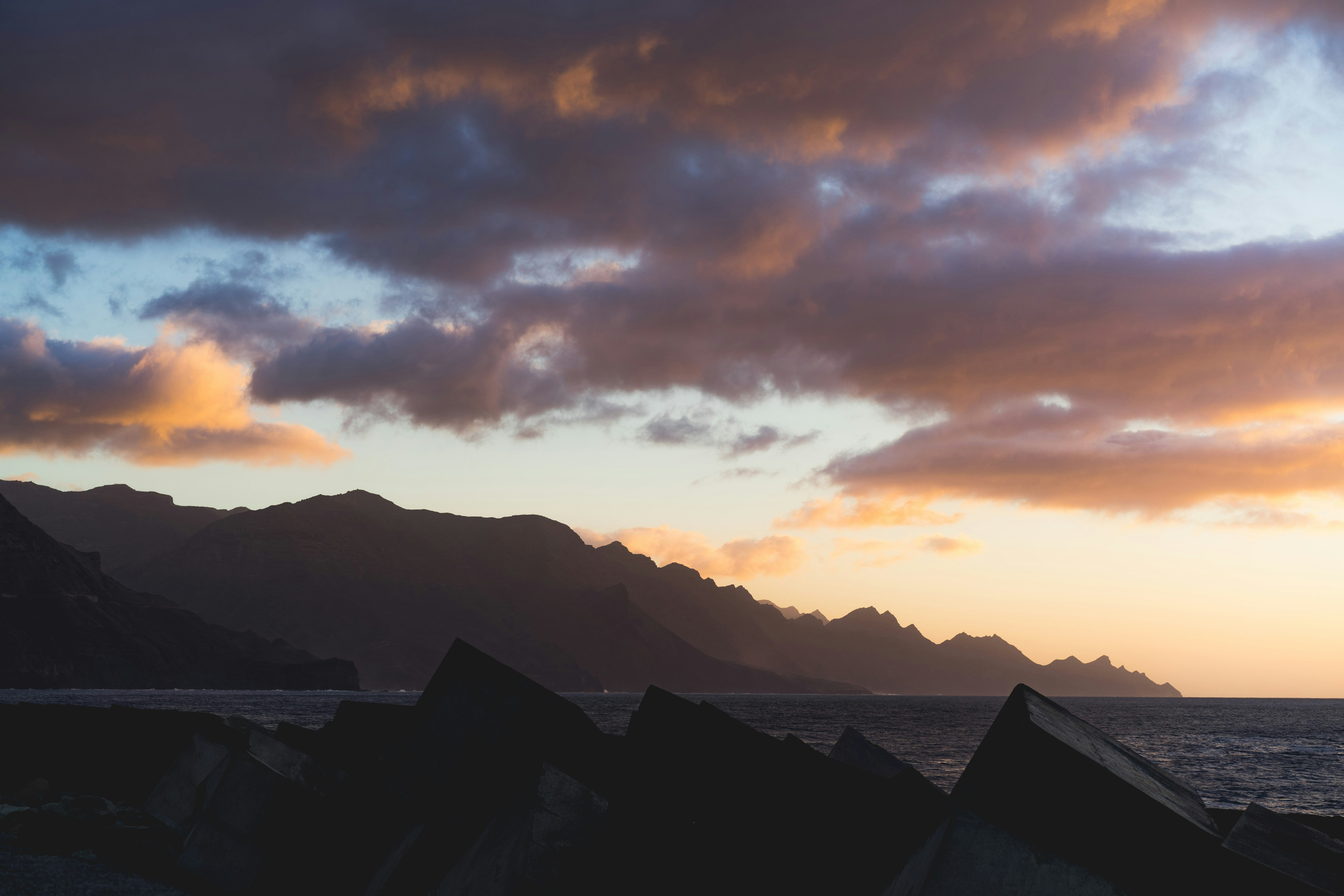 silhouette of mountains during sunset