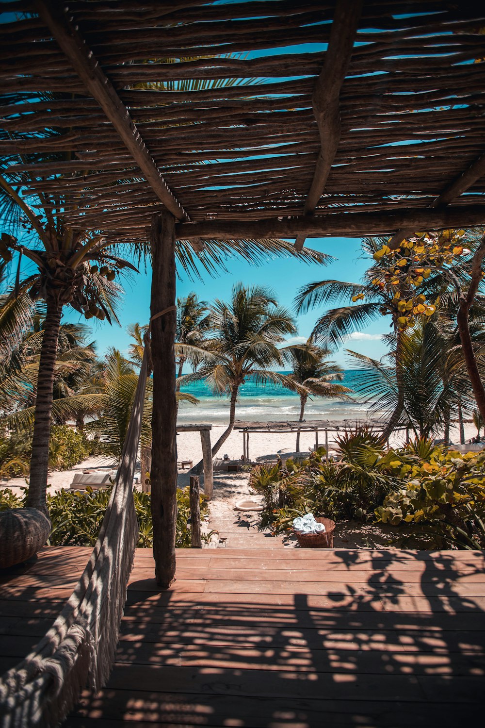 nipa hut under coconut palm trees