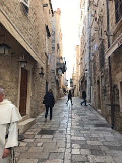 Cobblestone streets twisting through Porto’s old town, framed by vintage street lamps.