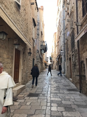 Cobblestone streets twisting through Porto’s old town, framed by vintage street lamps.