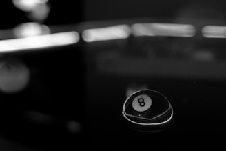 shallow focus photography of 8 ball