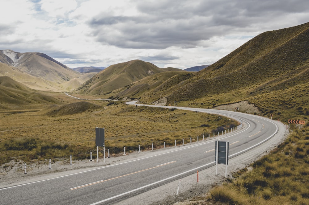 asphalt road between mountain