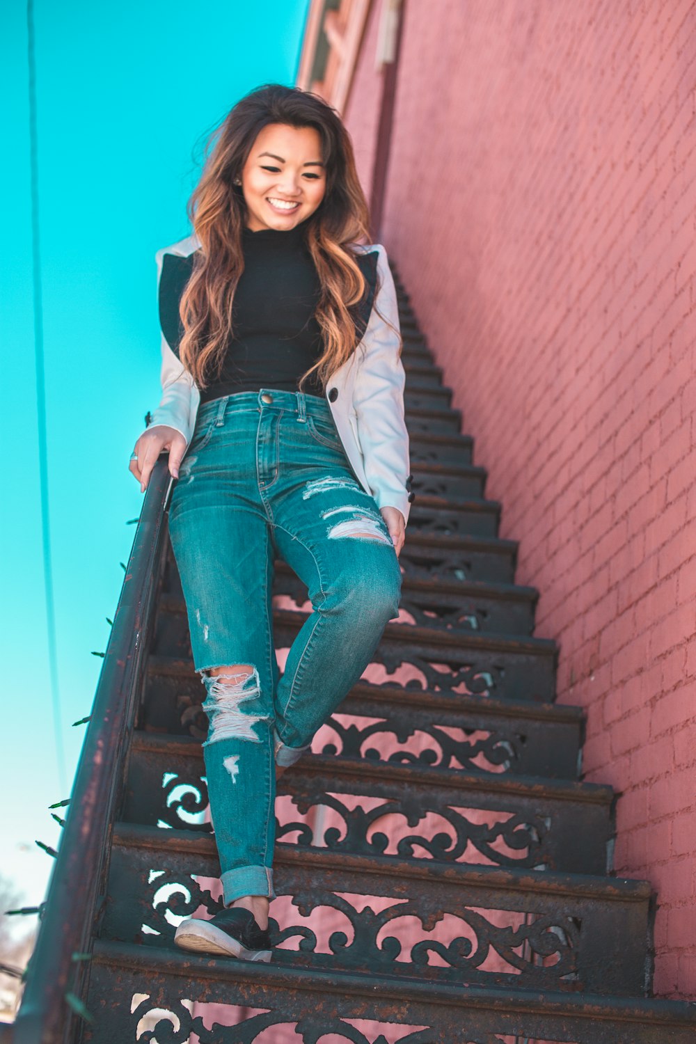 woman walking down to staircase