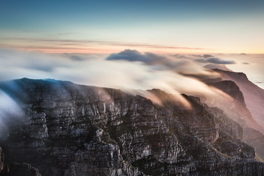 rock formation surrounded by sea of clouds in Table Mountain South Africa
