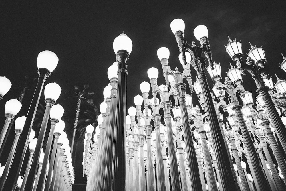 grayscale photography of lamp posts