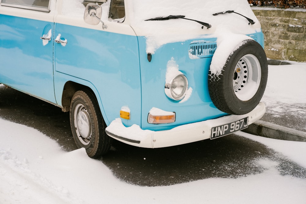 photo of teal and white Volkswagen Type 2 T2 van