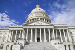 The United States Capitol under a blue sky