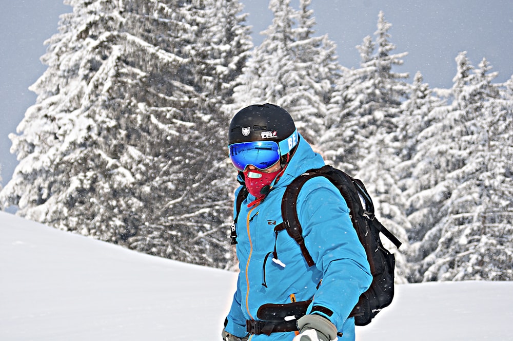 person wearing blue zip-up hooded jacket during daytime