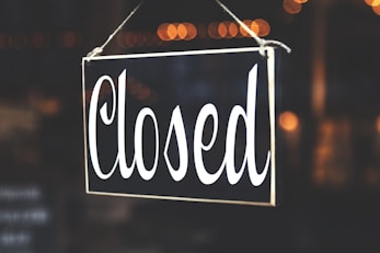 bokeh photography of closed signage