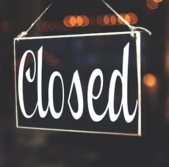 bokeh photography of closed signage