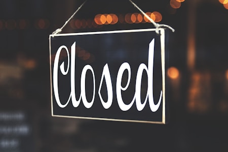 bokeh photography of closed signage