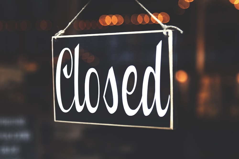 bokeh photography of closed signage