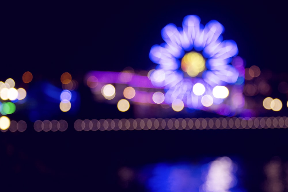 bokeh photography of ferris wheel during nighttime