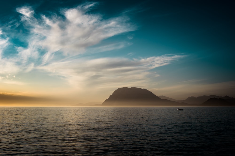 body of water across mountain