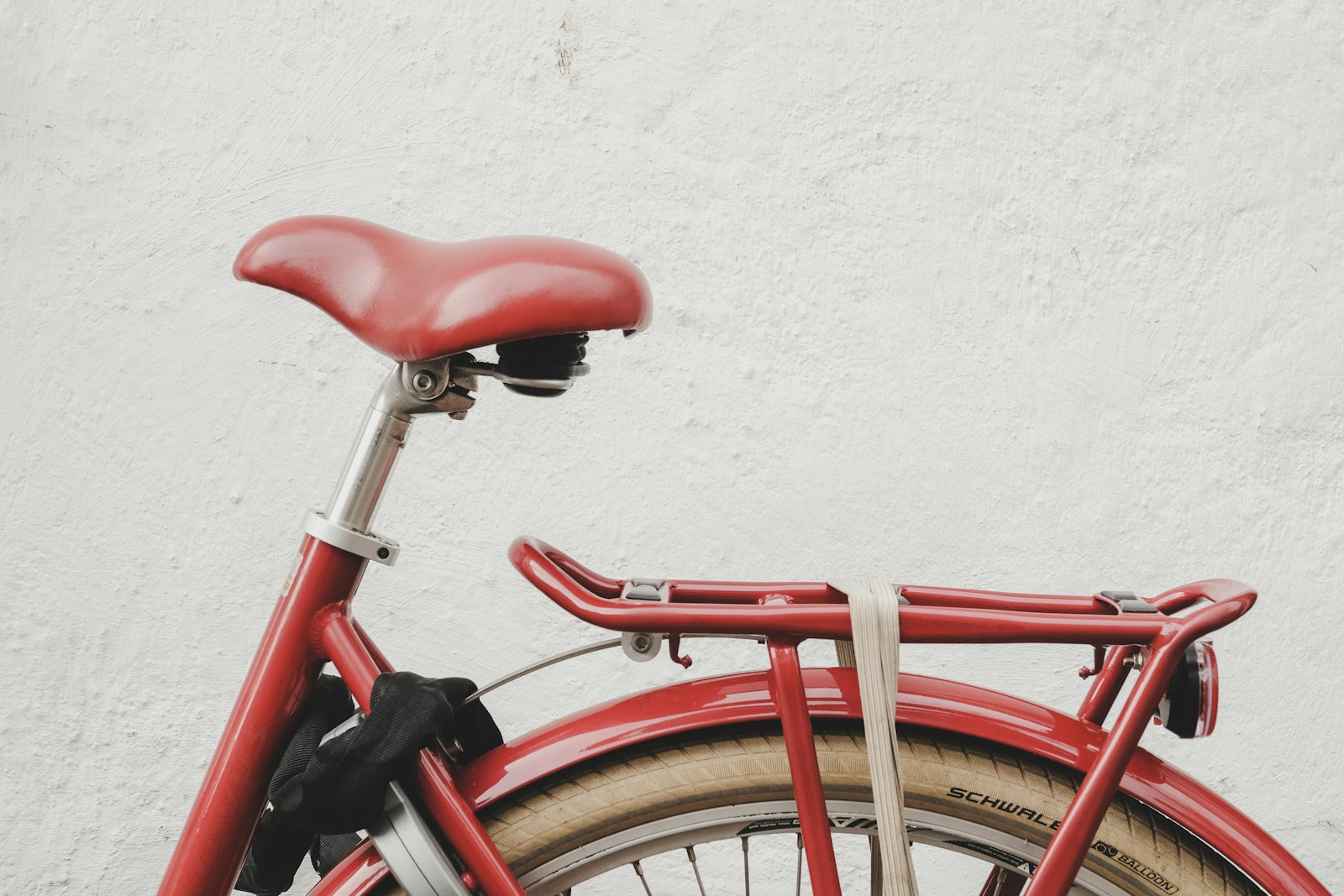 Fujifilm XF 16-55mm F2.8 R LM WR sample photo. Red bicycle near white photography