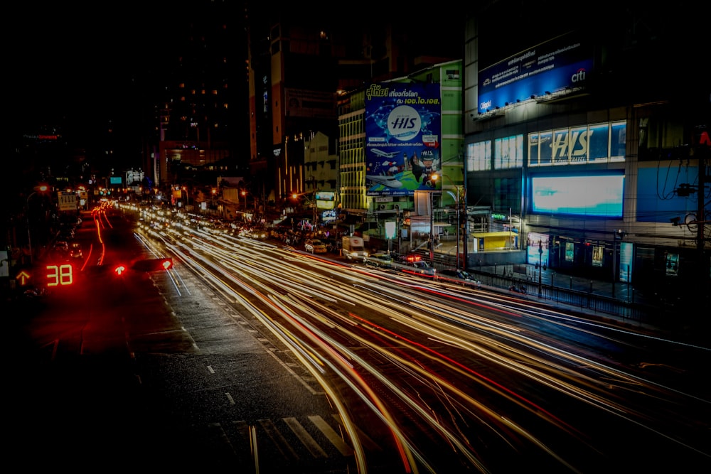 time lapse photo of roadside with open stalls