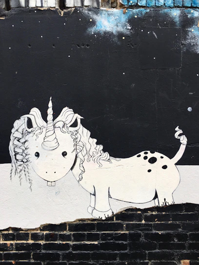 white and black unicorn mural