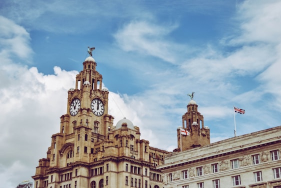 A historic British Parliament building under a clear sky.