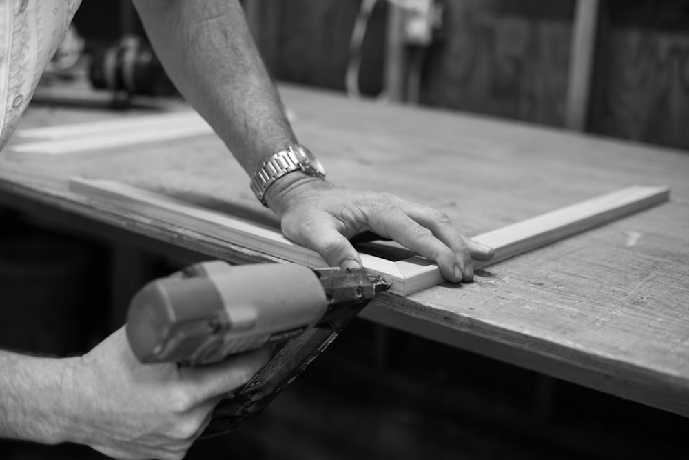 person doing wooden frame