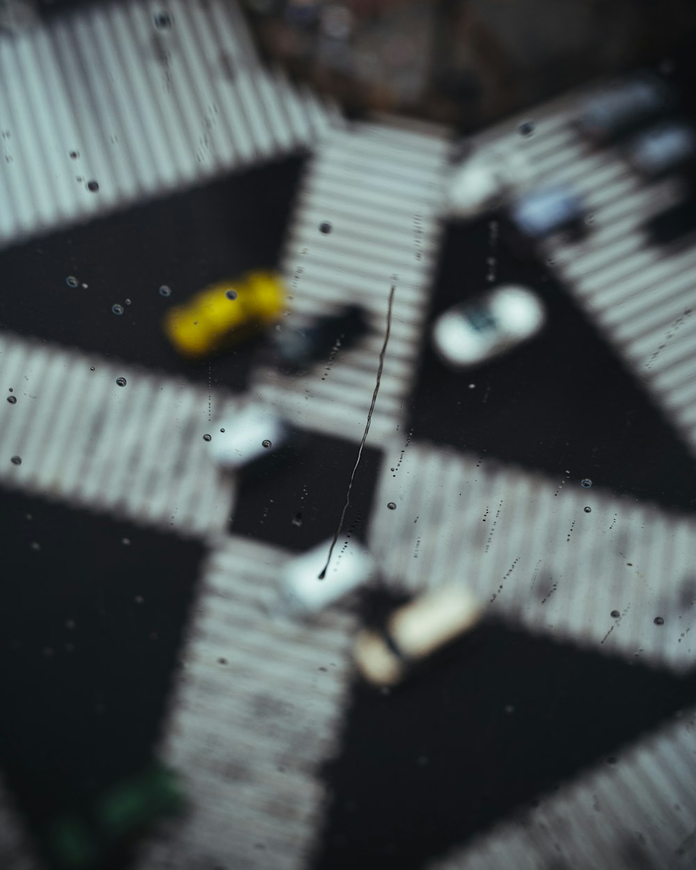 a black and white checkered floor with a yellow object on it