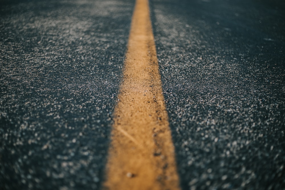 shallow focus of gray asphalt road