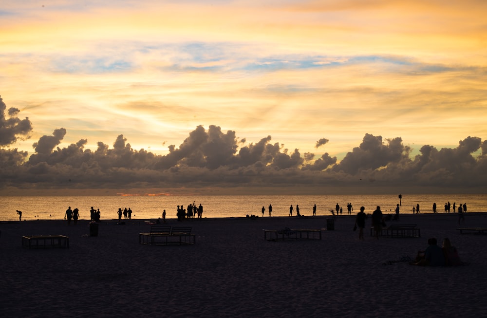 silhouette of people on the beach