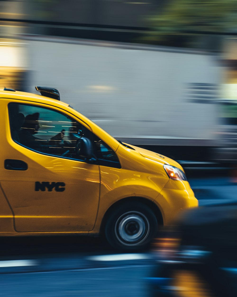 time lapse photography of yellow car