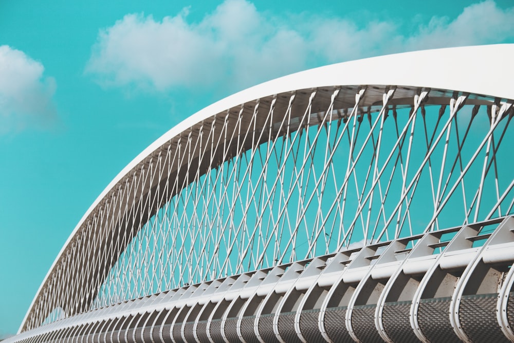 white suspension bridge under blue sky