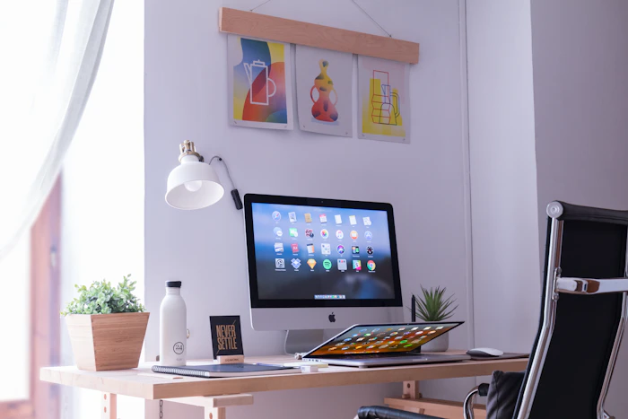 Minimal home office with a wooden desk and computer